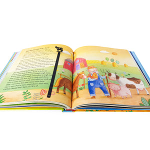 Metal cow bookmark showing full 17 cm blade in open children's book with farm illustrations