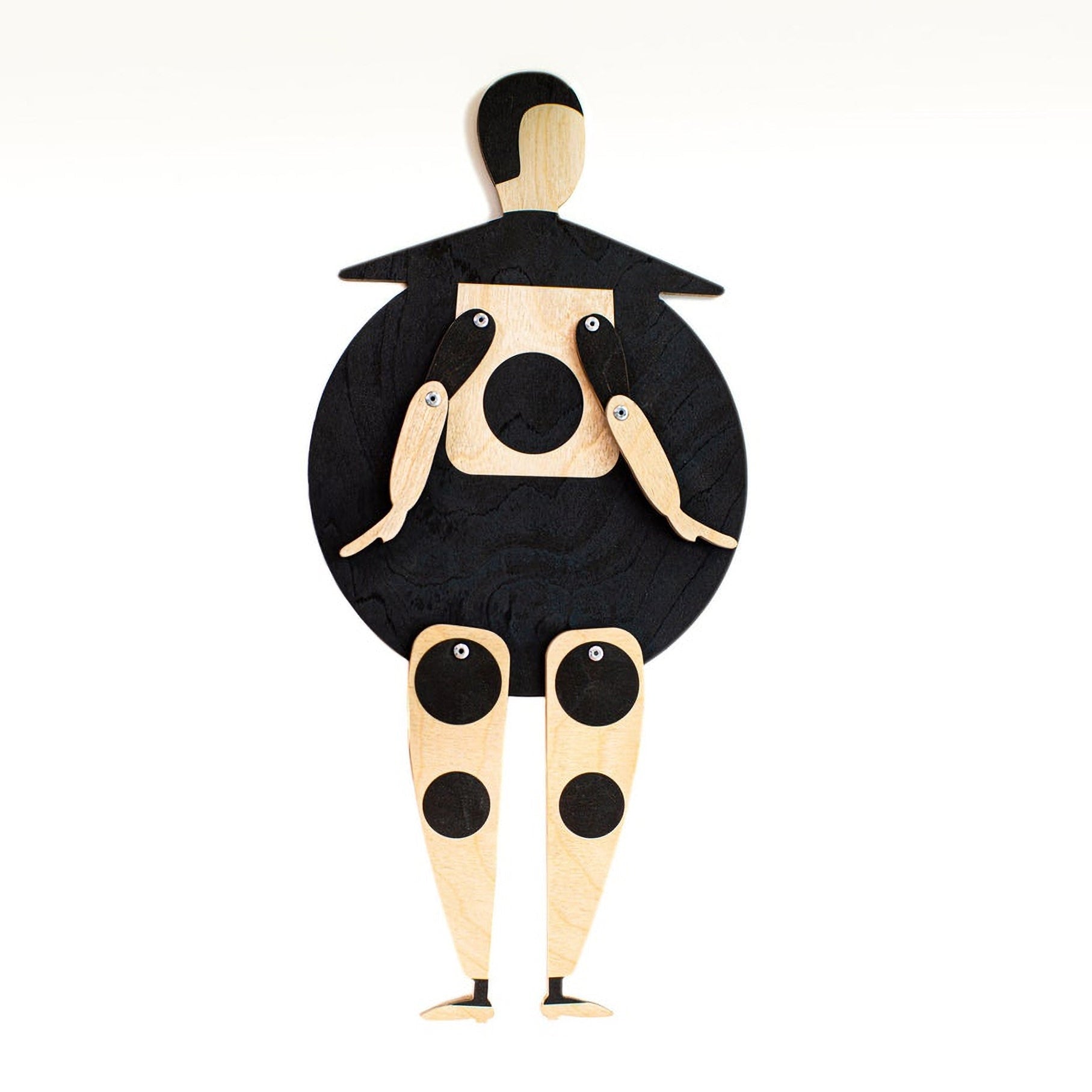 Bauhaus Beetle wooden puppet on white background — round black body, natural wood head and jointed limbs with black dots
