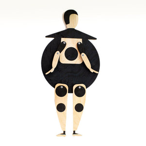 Bauhaus Beetle wooden puppet on white background — round black body, natural wood head and jointed limbs with black dots