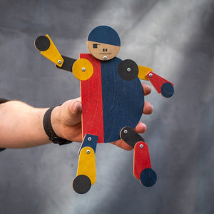 bauhaus performer wooden acrobat toy in hand articulated figure scale view