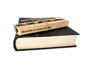 Bookmark "Horse" on the wooden packaging block. The block says reading is good for you.