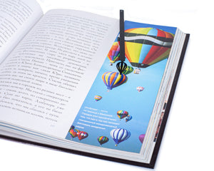 Hot Air Balloon metal bookmark marking a page in an illustrated book