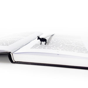 Close-up of black steel donkey bookmark on white background showing full powder-coated silhouette