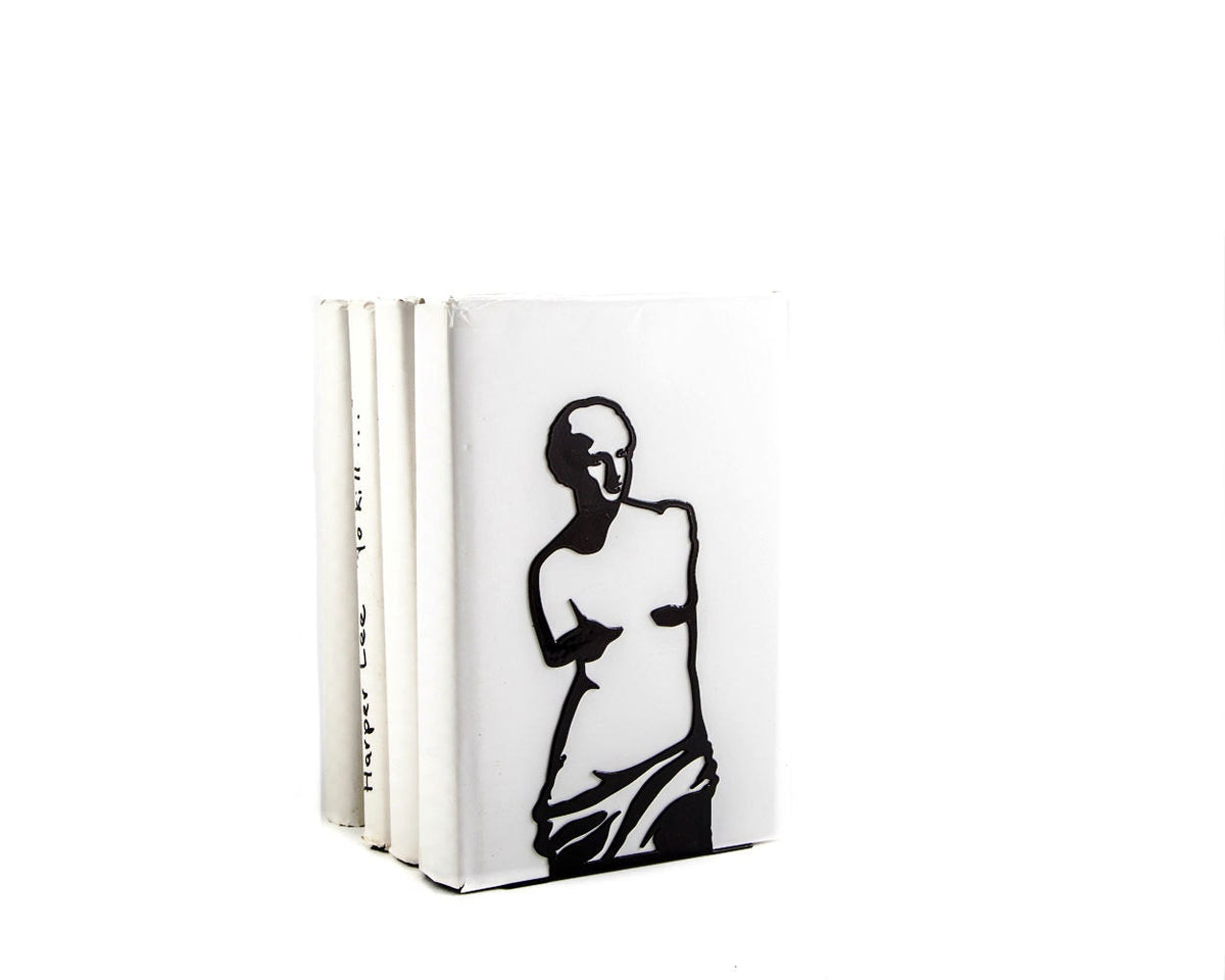 White metal bookend with black silhouette of Venus de Milo, holding books upright in a modern minimalist style, artistic and elegant design.