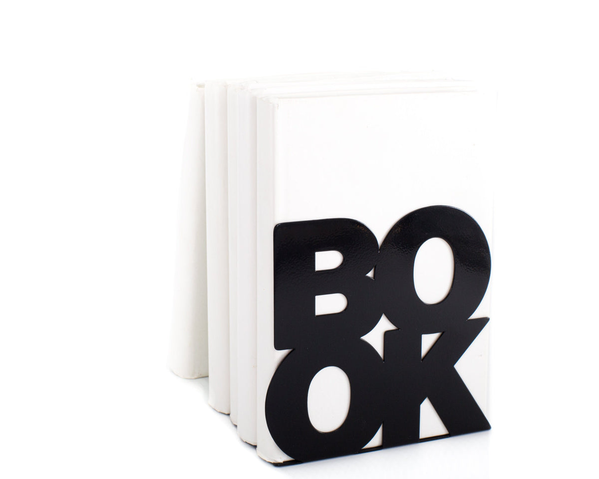 Black metal bookends. The work book is cut out of metal. It is a side of the bookend which holds the books. The books are standing on the metal base of the bookends, thus holding them straight up. Made by us in our workshop in Ukraine.