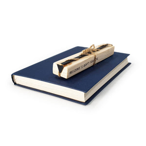 Minimalist Triangle metal bookmark with the engraved wooden gift block it ships with