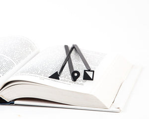 Minimalist Triangle metal bookmark shown together with other bookmarks from the range