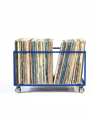 Blue metal vinyl record storage cart on wheels, filled with a large collection of LPs, photographed against a clean white background.