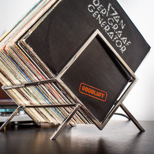 Close view of the stainless steel 1Romb frame holding vinyl records