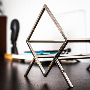 Hand-welded stainless steel frame detail on the 1Romb record stand