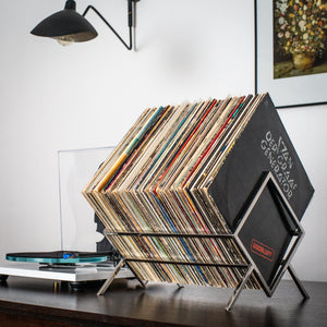 Stainless steel 1Romb vinyl record stand filled with records in a listening room