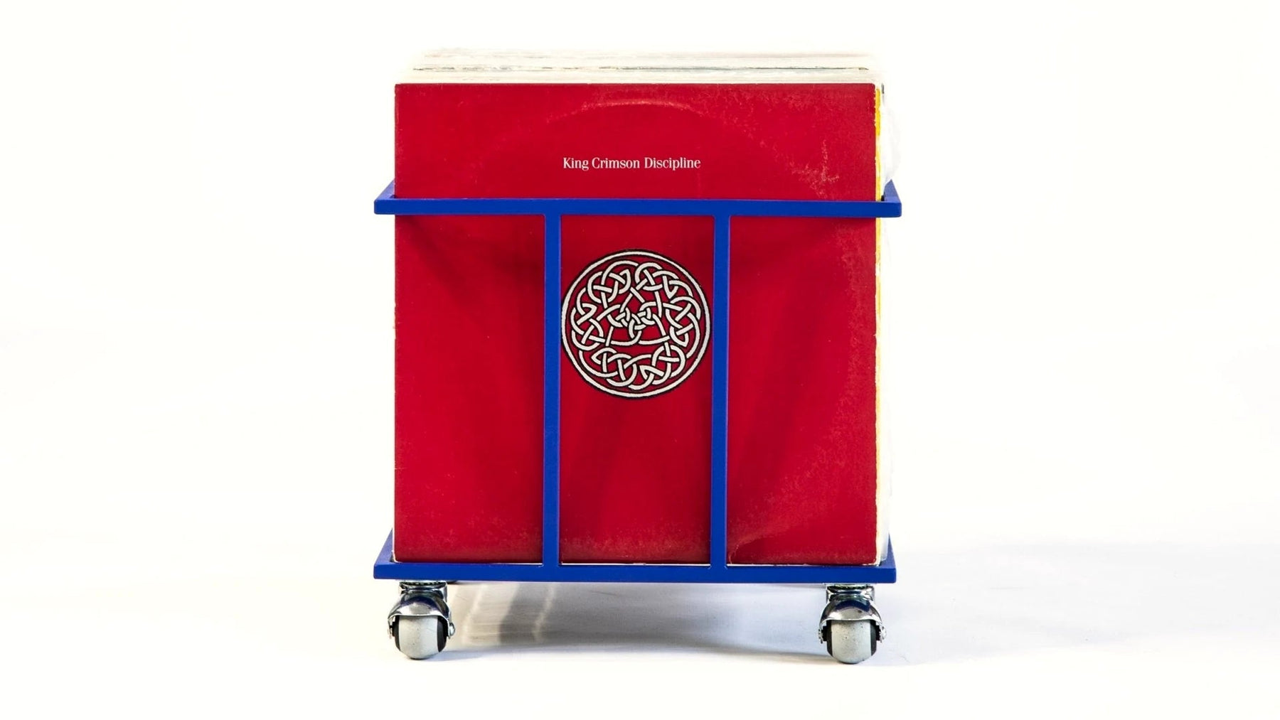 Steel vinyl crate holding a row of LP records.