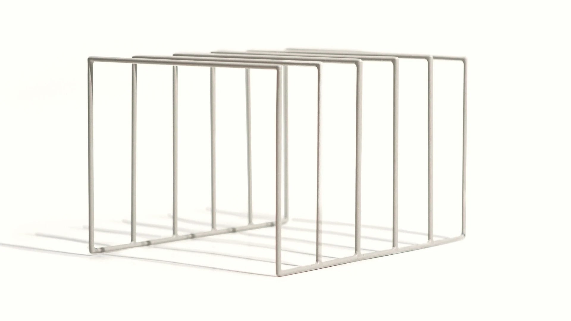 Powder-coated steel record rack with a matte white finish.