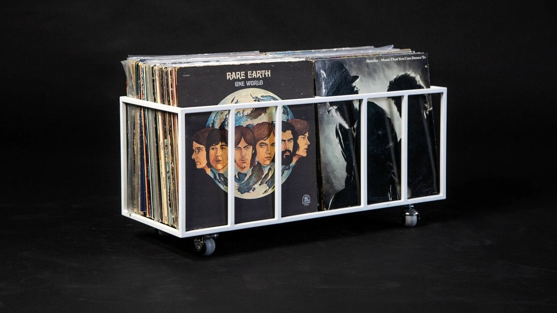 Steel record crate on castors holding a vintage LP collection.