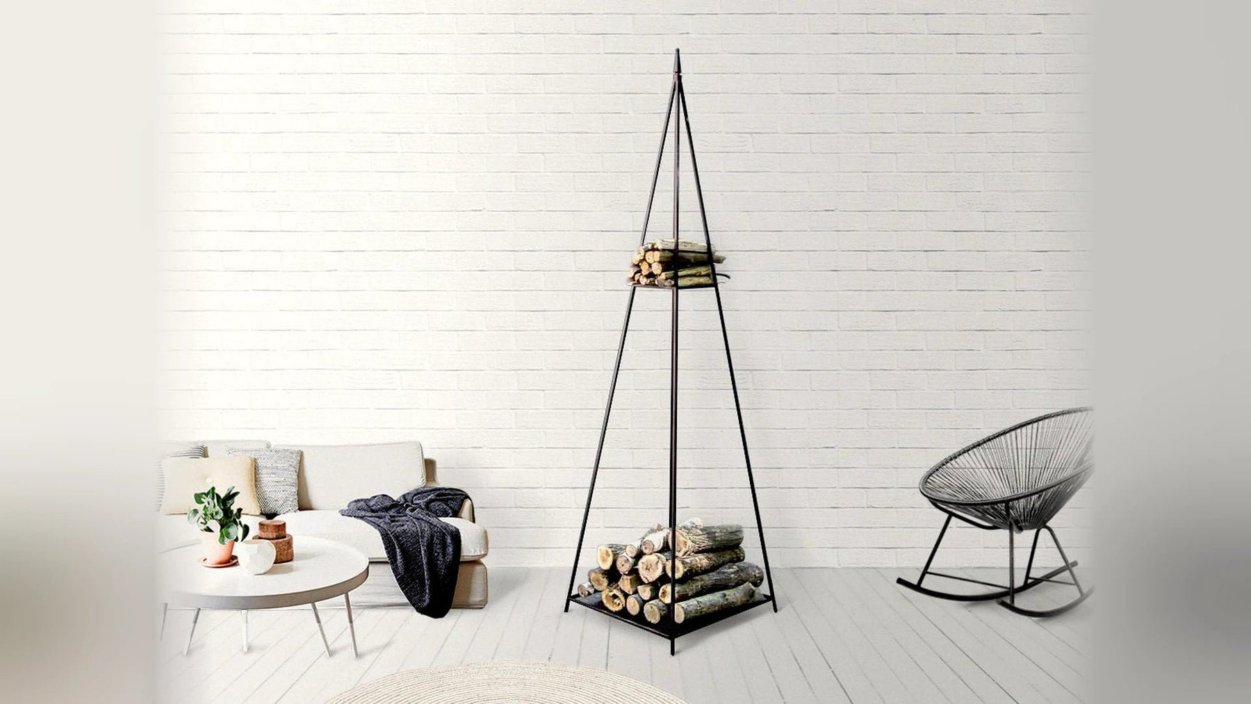 Black steel pyramid log holder in a bright white Scandinavian living room.