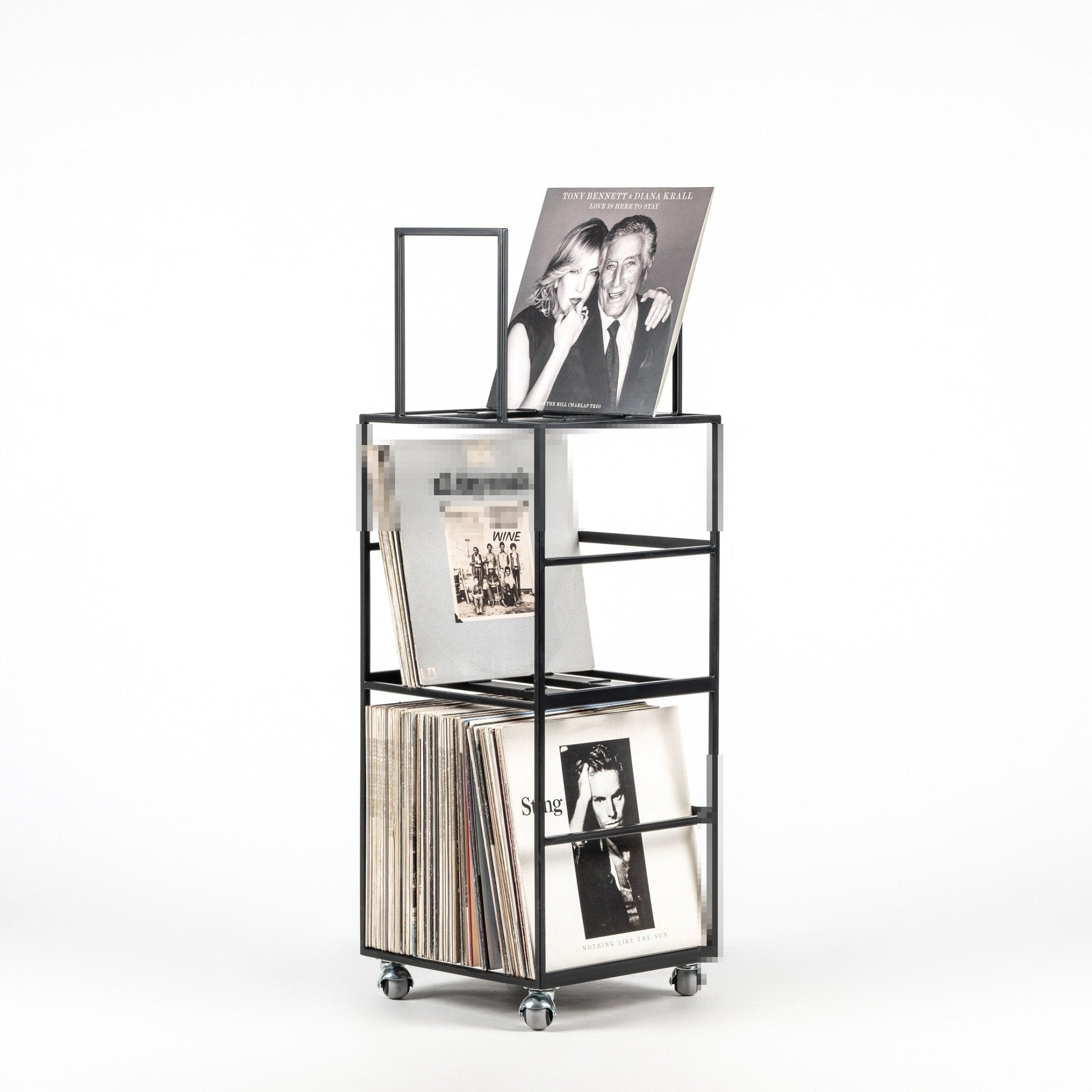 Black multi-tier steel vinyl record stand filled with LPs