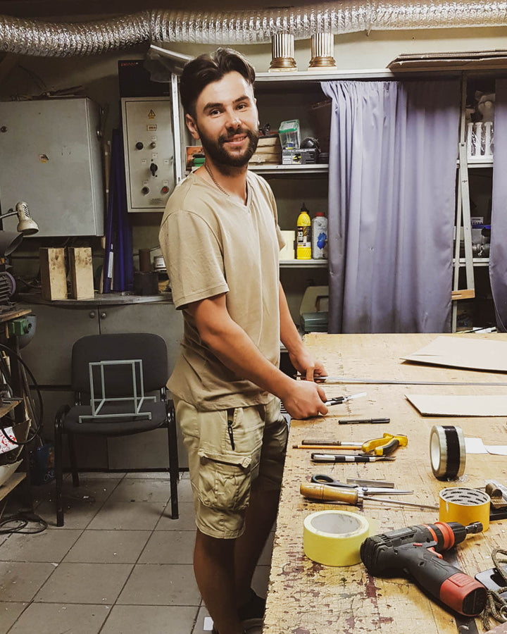 Dmitry Olshevskiy working at a bench in the Atelier Article workshop