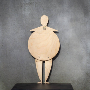 Back of the Bauhaus Beetle puppet on a shelf — natural birch plywood with wall-hanging mount