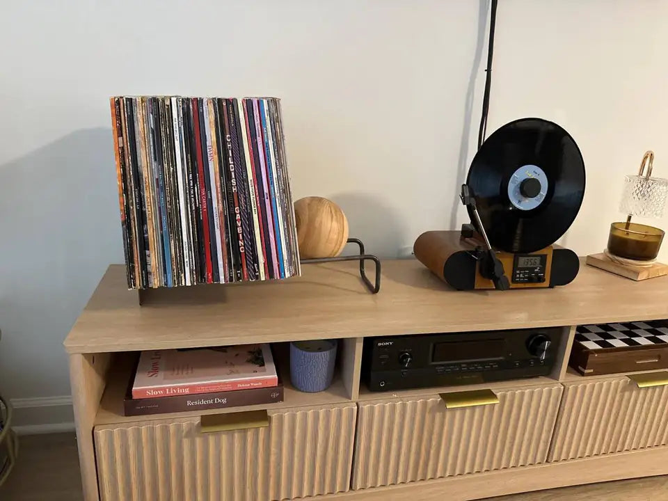 Jacob’s Atelier Article record stand with wooden ball beside a turntable on a media console