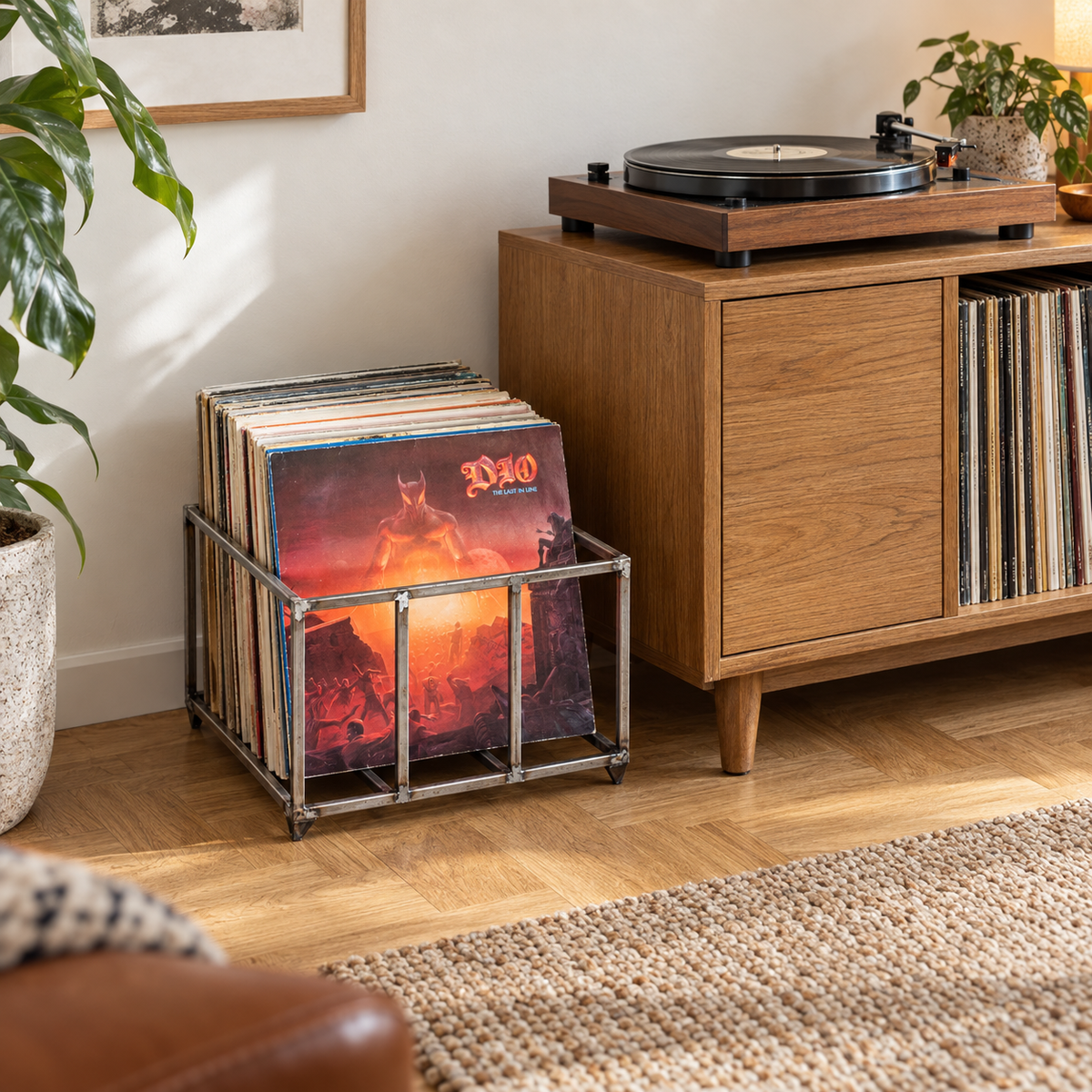 Atelier Article raw steel vinyl record crate filled with LPs beside an oak cabinet and turntable in a listening room