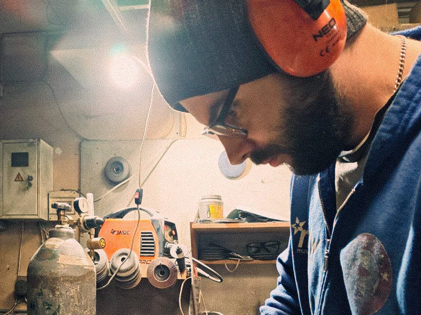 Sashko of Atelier Article working with metal in the Cherkasy workshop