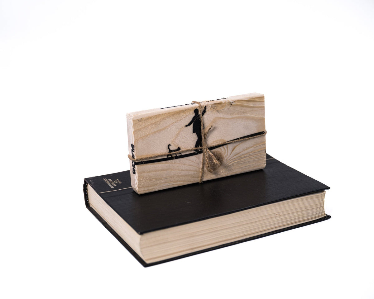 Balancing Act metal bookmark shown with its wooden gift block