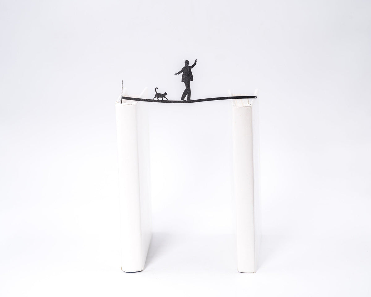 Balancing Act metal bookmark shown flat on a white background