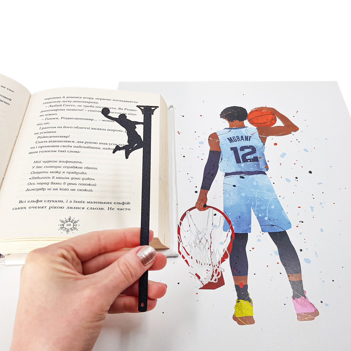 Basketball metal bookmark marking a page in an illustrated book