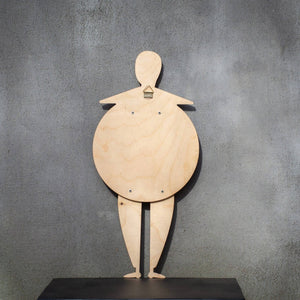 Back of the Bauhaus Beetle puppet on a shelf — natural birch plywood with wall-hanging mount
