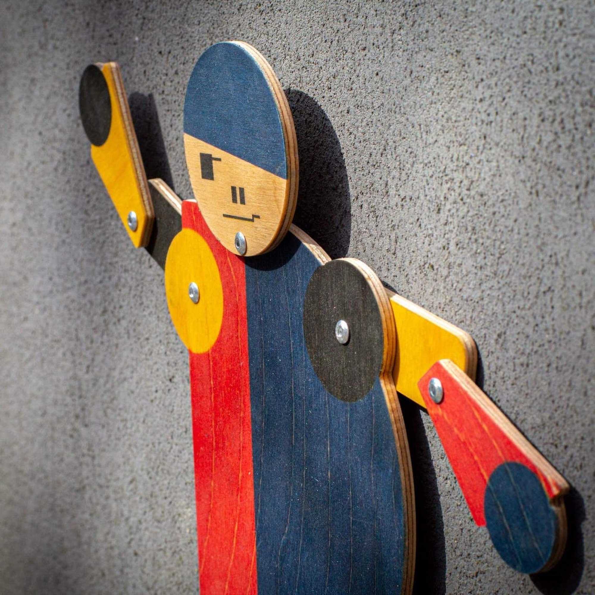 wooden acrobat toy bauhaus articulated figure side view close up