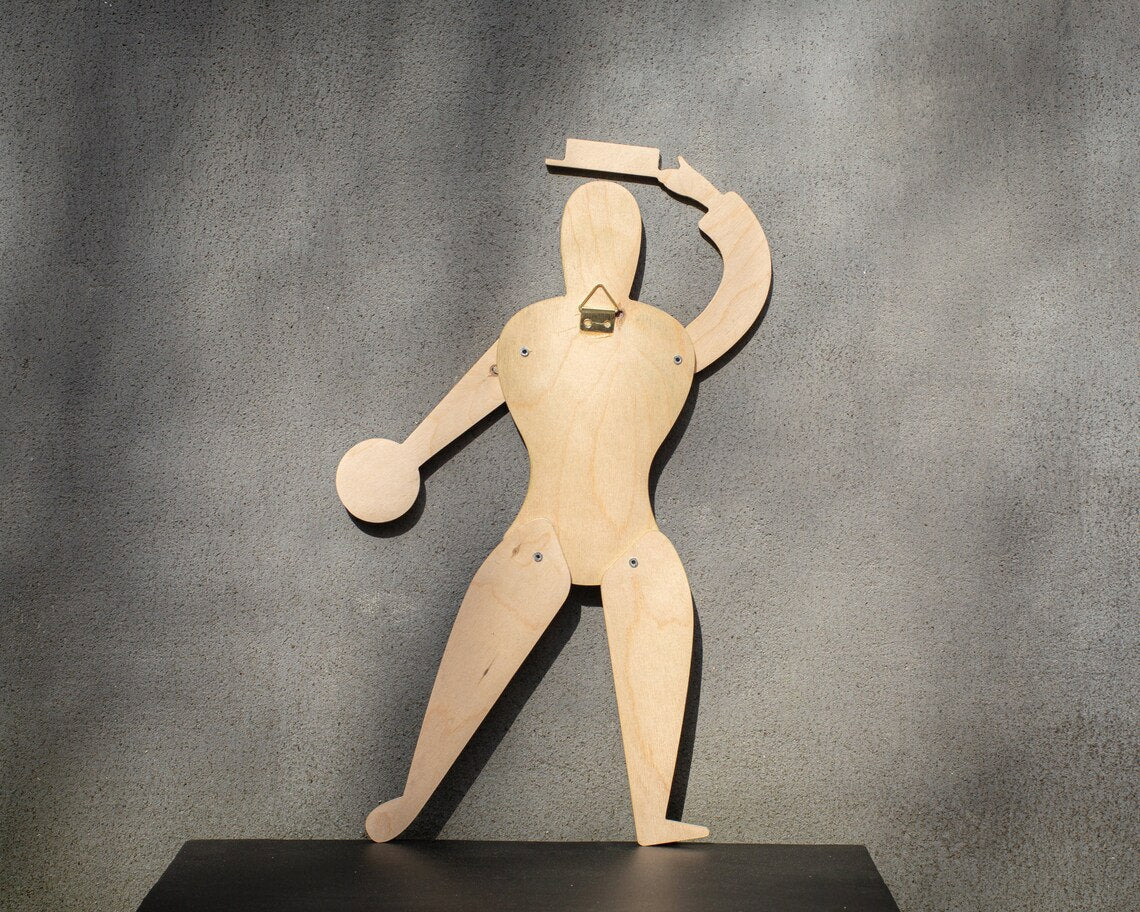 Back of Bauhaus puppet showing natural birch plywood and brass wall hook