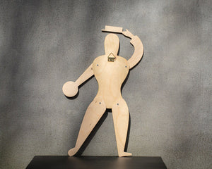 Back of Bauhaus puppet showing natural birch plywood and brass wall hook