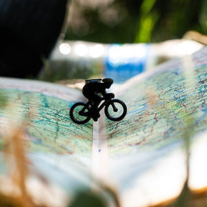 Bike Racing metal bookmark on a coloured background