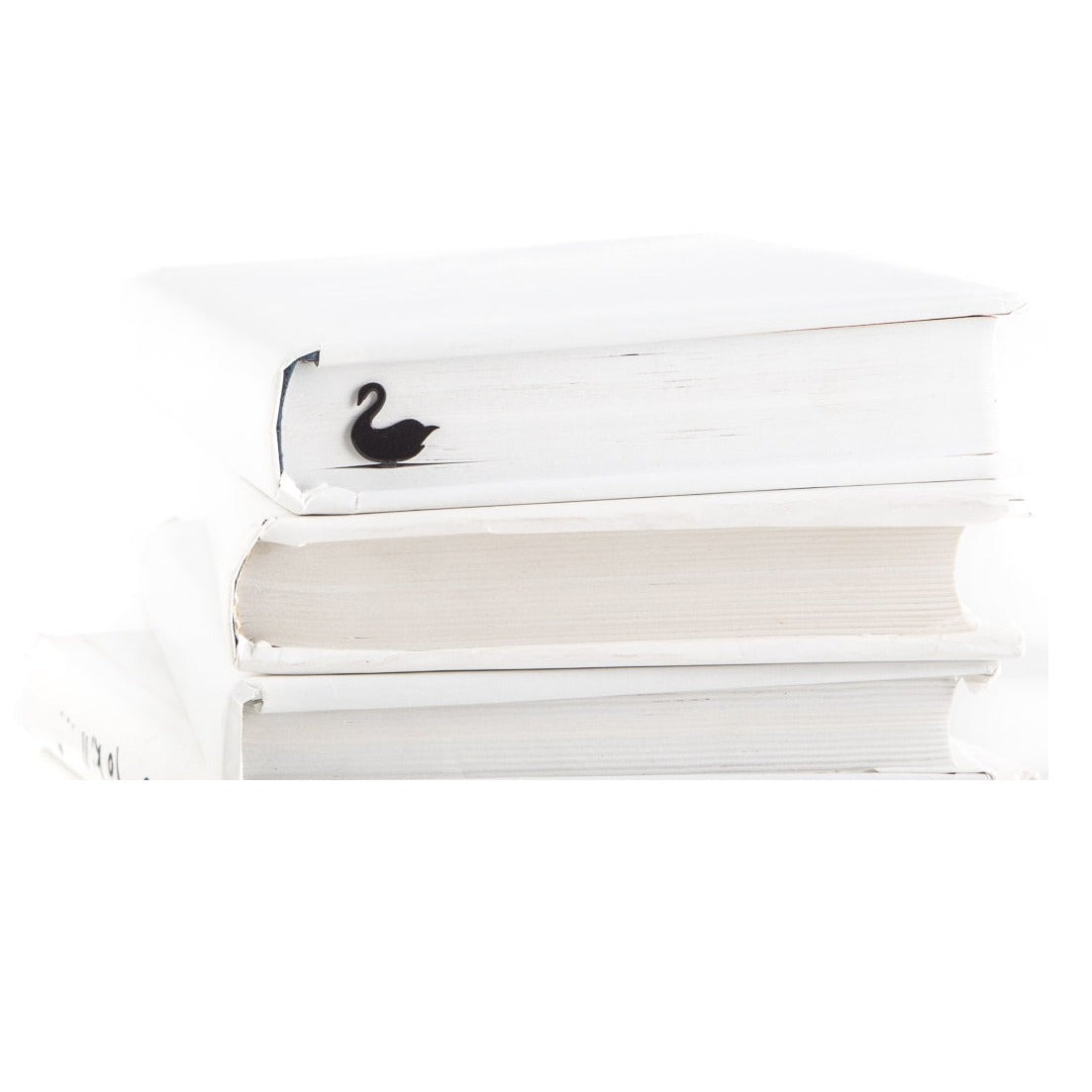 Black Swan metal bookmark shown with a stack of books