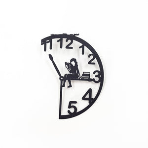 Black metal Book O’Clock bookmark with a clock-shaped design and a seated reading figure, shown isolated on a white background.