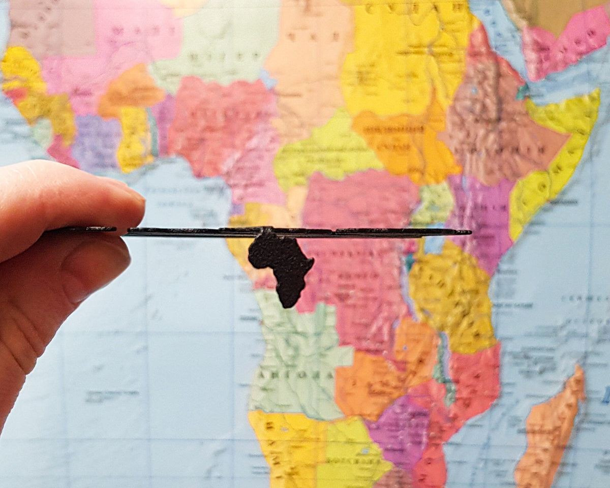 Africa Map metal bookmark on a coloured background