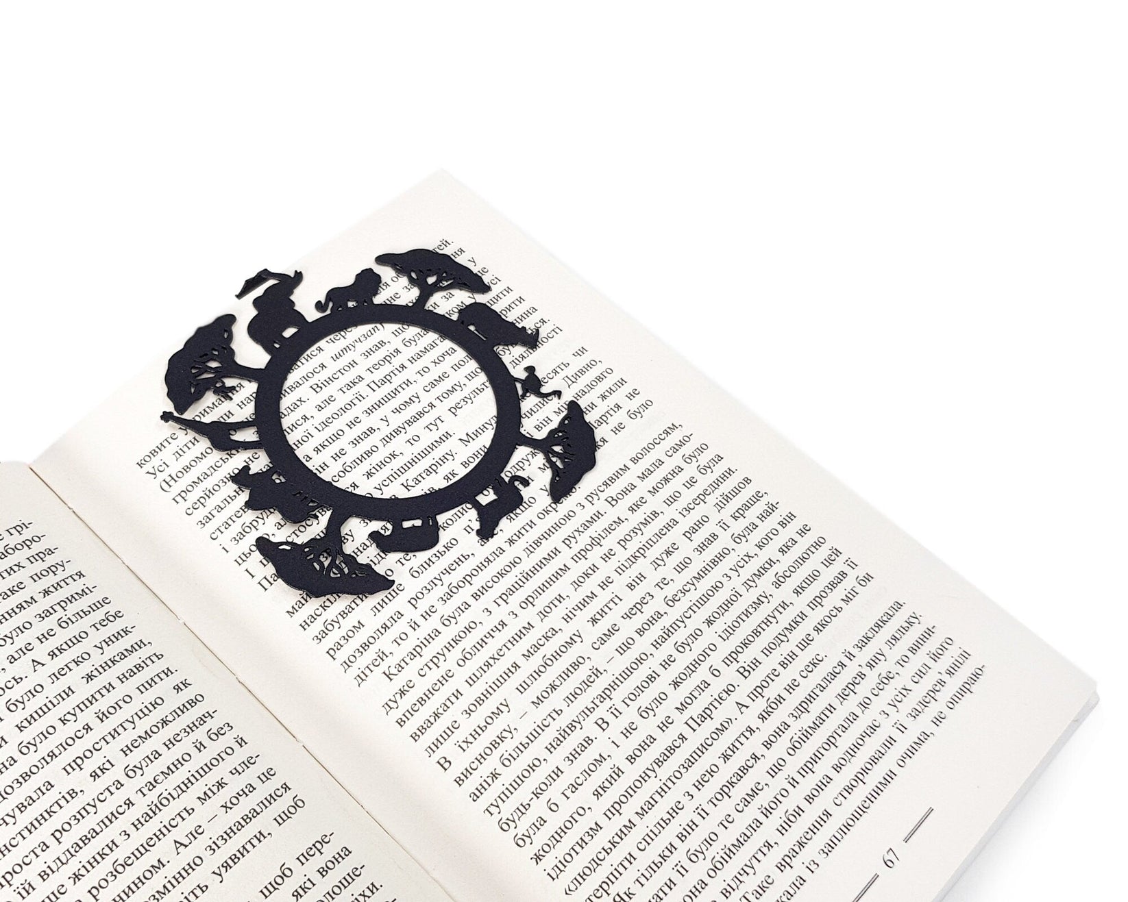 Africa Map metal bookmark marking a page in an open book