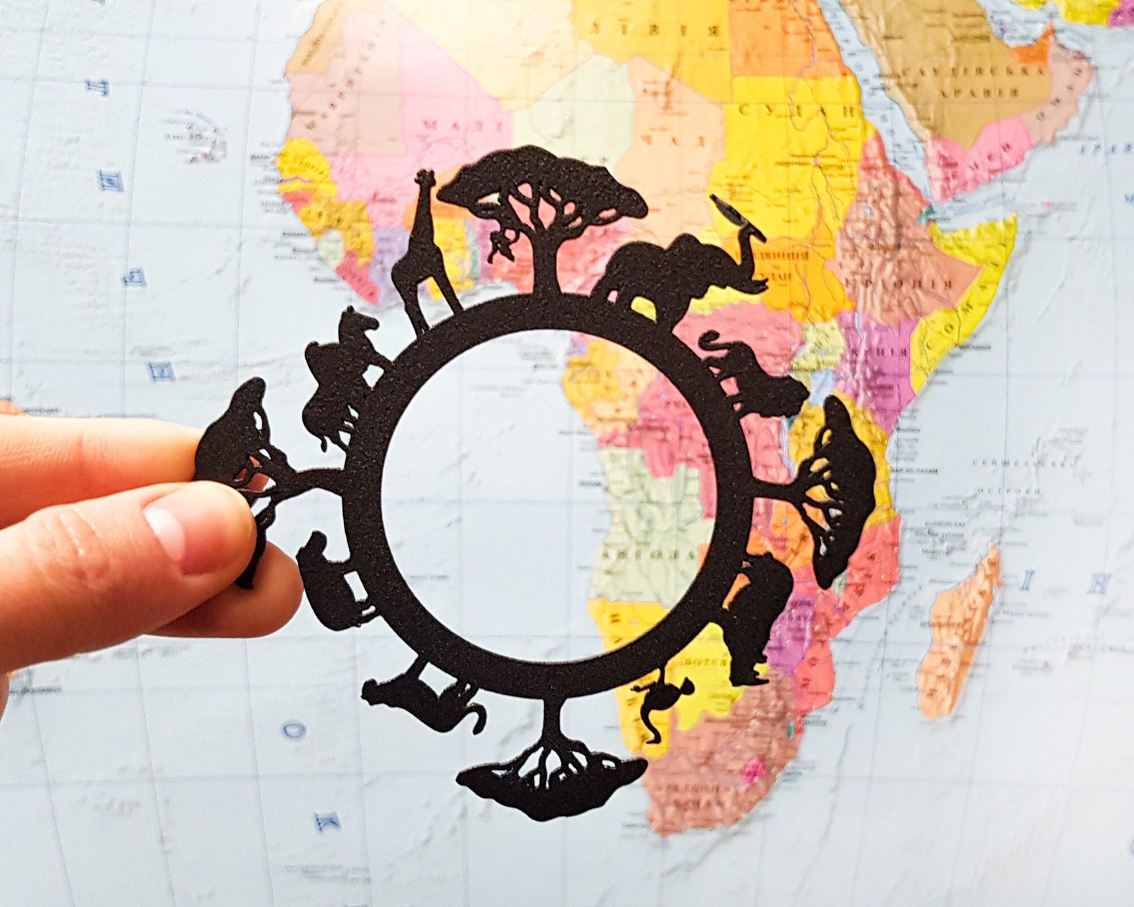 Africa Map metal bookmark shot on a coloured surface