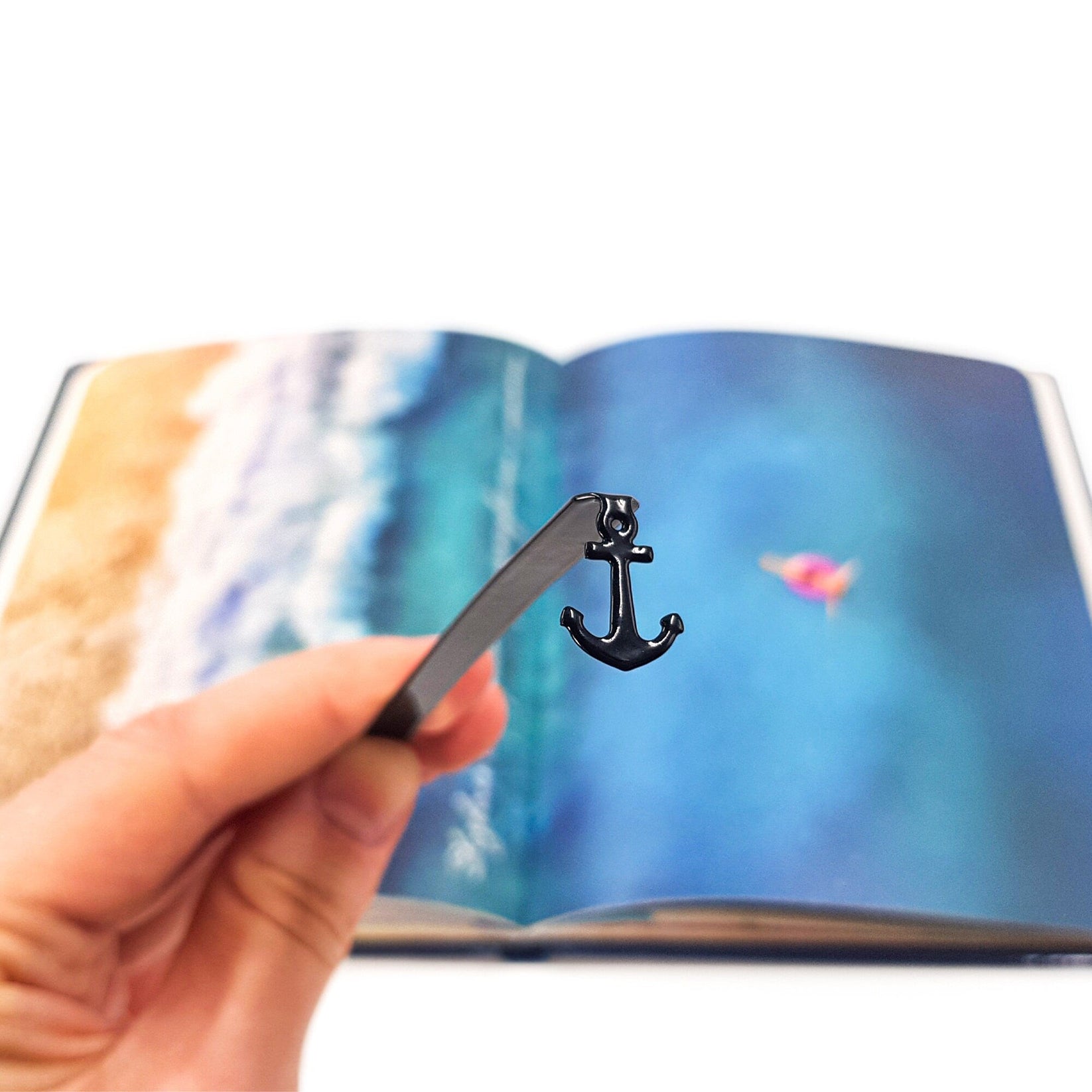 Anchor metal bookmark on an illustrated page