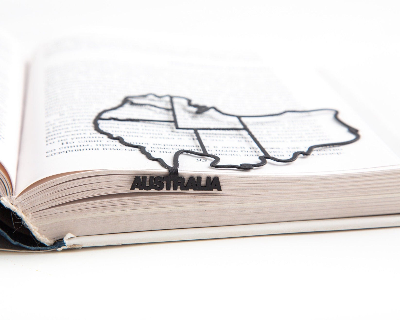 Australia metal bookmark set into the gutter of an open book