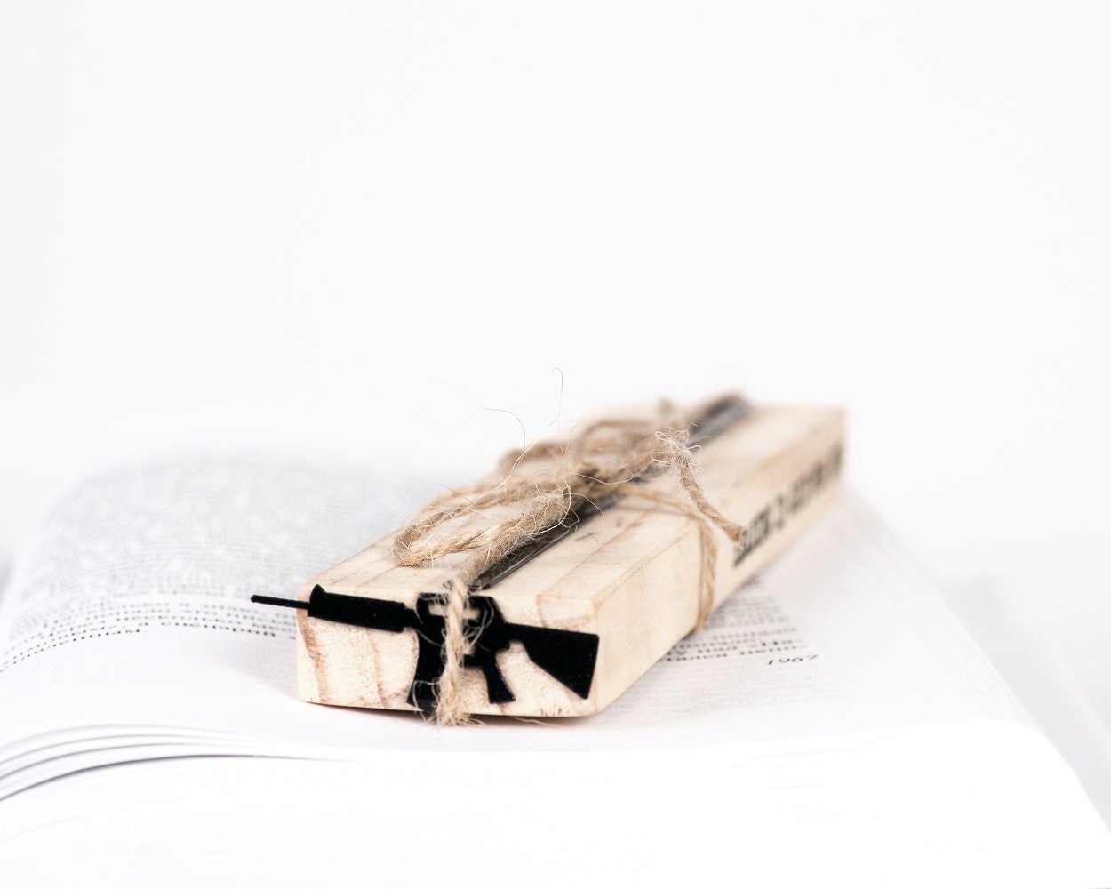 Automatic Rifle metal bookmark with the engraved wooden gift block it ships with