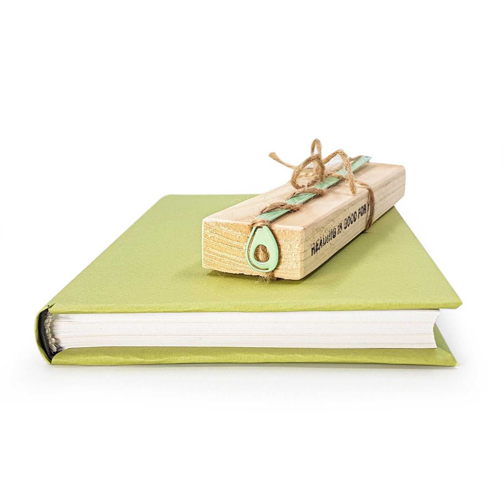 Avocado metal bookmark with the engraved wooden gift block it ships with