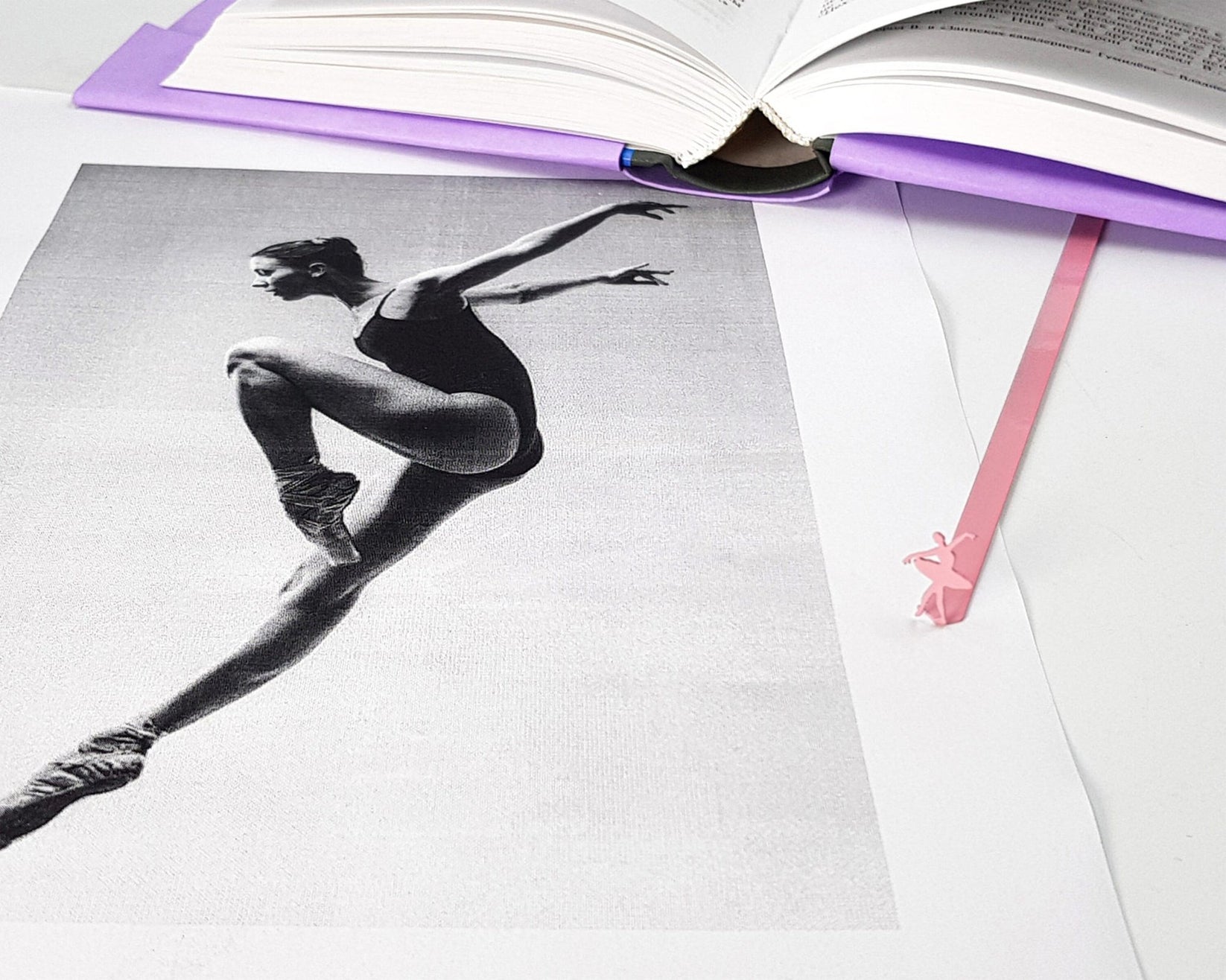 Ballet Dancer metal bookmark in red marking a page in an illustrated book