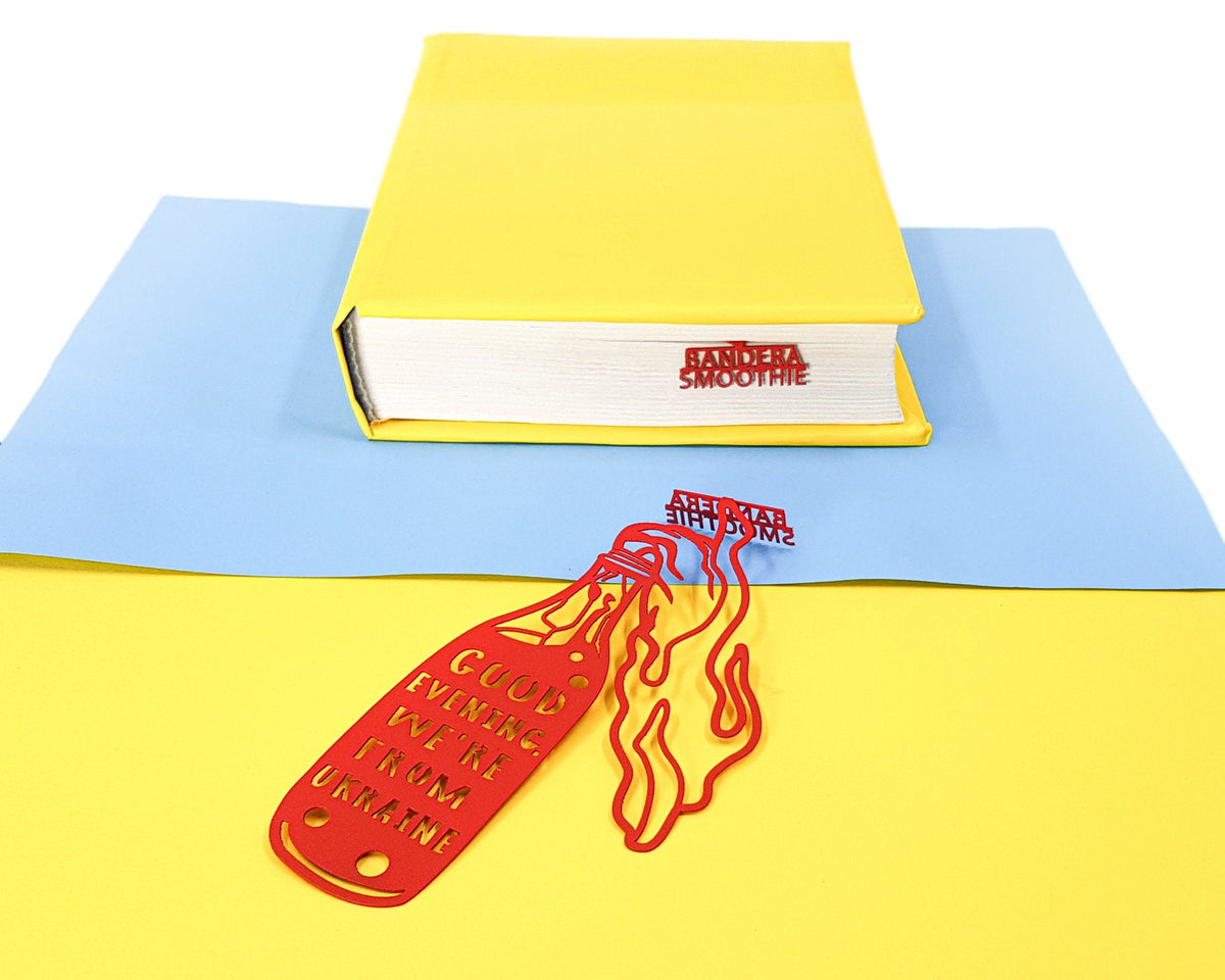 Bandera Smoothie metal bookmark in red on a coloured background