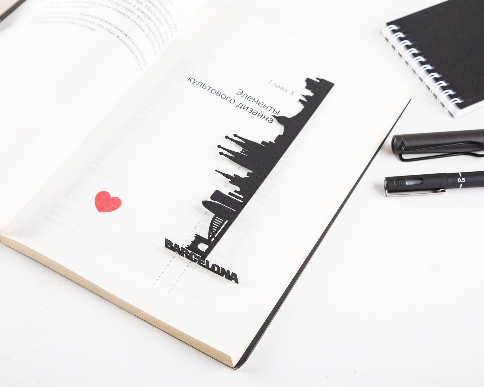 Barcelona Cityscape metal bookmark tucked into a notebook