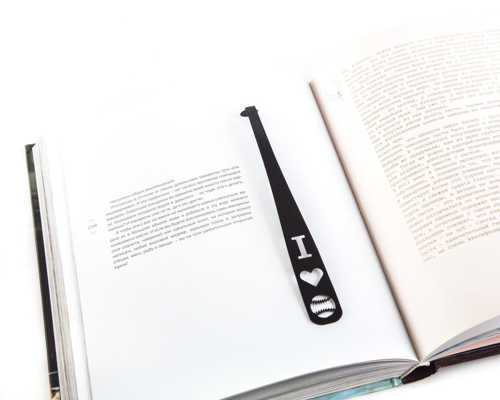 Baseball Love metal bookmark resting on the pages of an open book