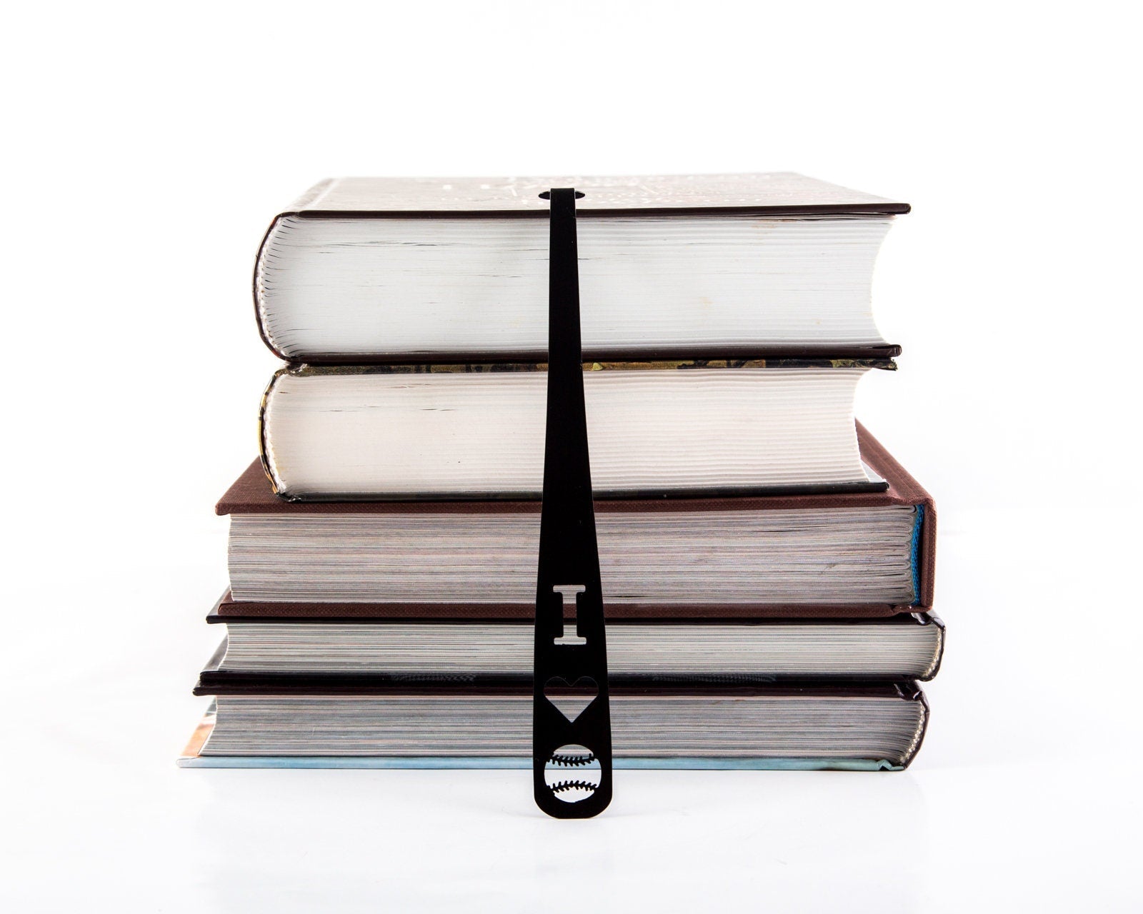 Baseball Love metal bookmark shown with a stack of books