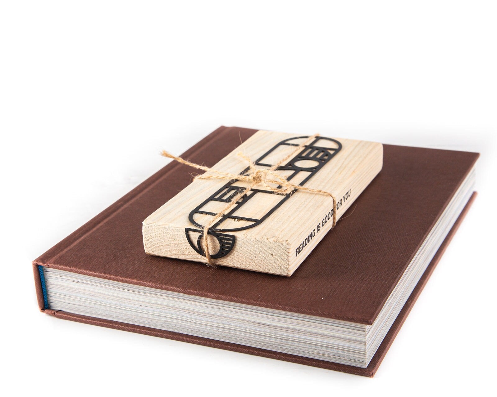 Bauhaus Geometry metal bookmark packed with kraft paper and twine as a gift