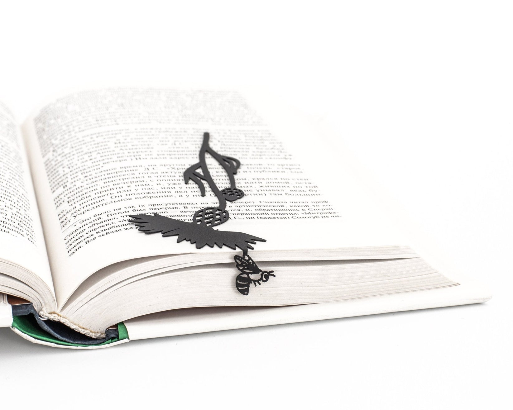 Beautiful Knapweed and the Bee metal bookmark resting on the pages of an open book