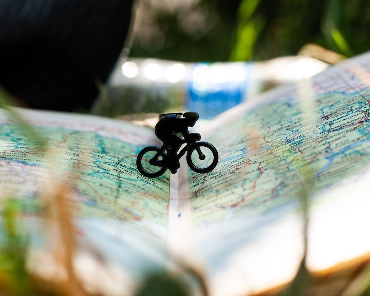 Bike Racing metal bookmark on a coloured background